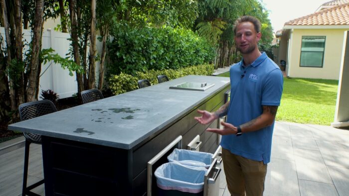 https://rtaoutdoorliving.com/wp-content/uploads/2022/04/43141-coyote-outdoor-kitchen-trash-pullout-convenience-at-your-fingertips.jpg