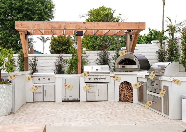 an rta outdoor kitchen with multiple outdoor kitchen appliances with price tags on them under a pergola in a backyard