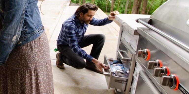 Person Reviewing Outdoor Kitchen Cabinet materials and components