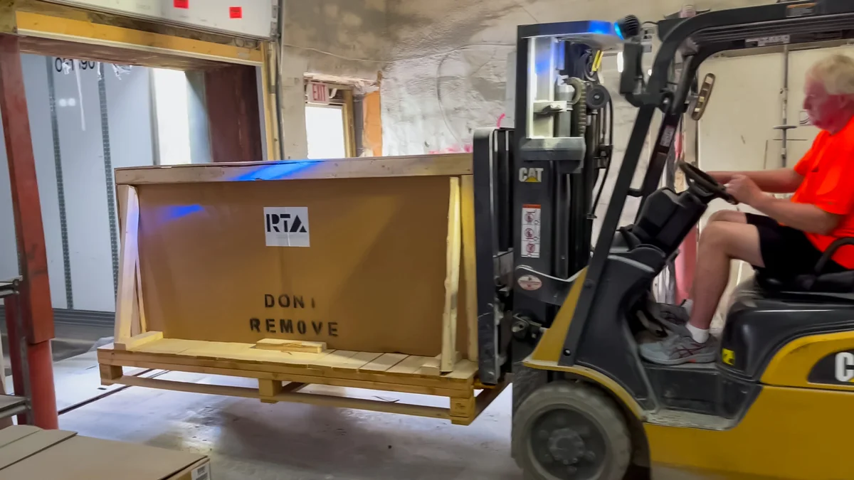 person preparing rta outdoor kitchen for shipment