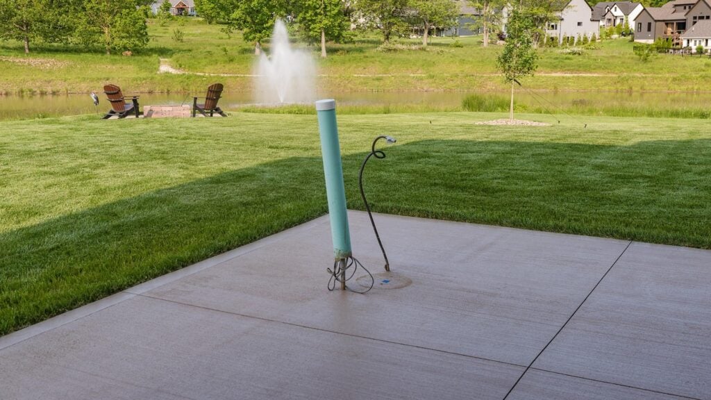 Utility line stub on a patio ready for an outdoor kitchen