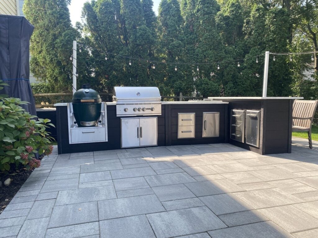 RTA outdoor kitchen with Coyote appliances and a kamado grill
