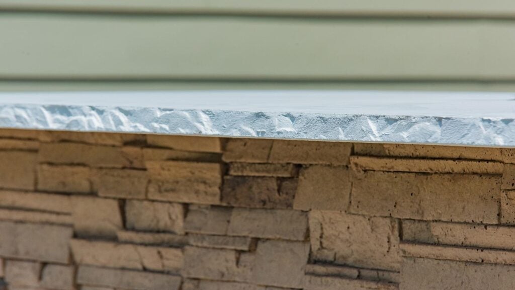 Close-up of an RTA outdoor kitchen stone finish and countertop